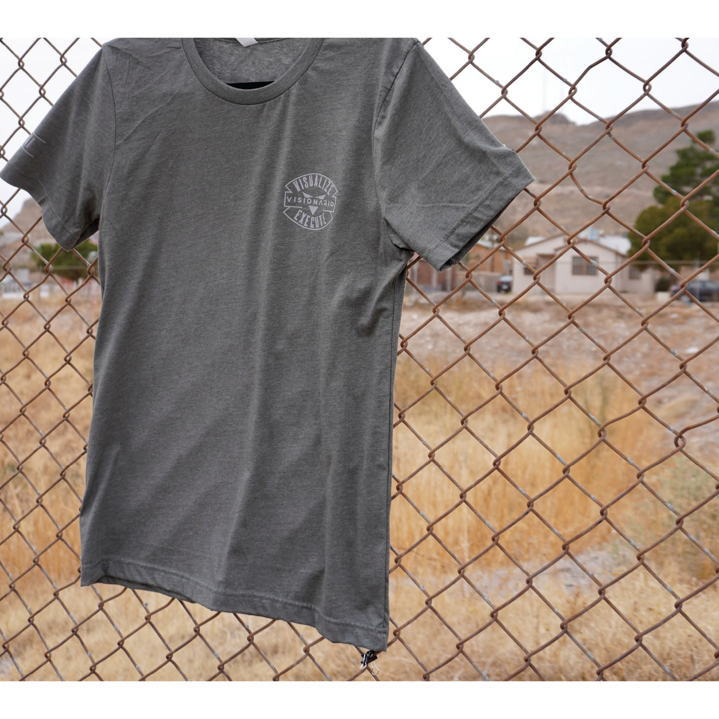 HEATHER MILITARY GREEN TEE GREY AUTHENTIC EMBLEM POCKET SIZE DESIGN (LEFT SIDE). Roman numerals "2021" STAMPED ON RIGHT SLEEVE.